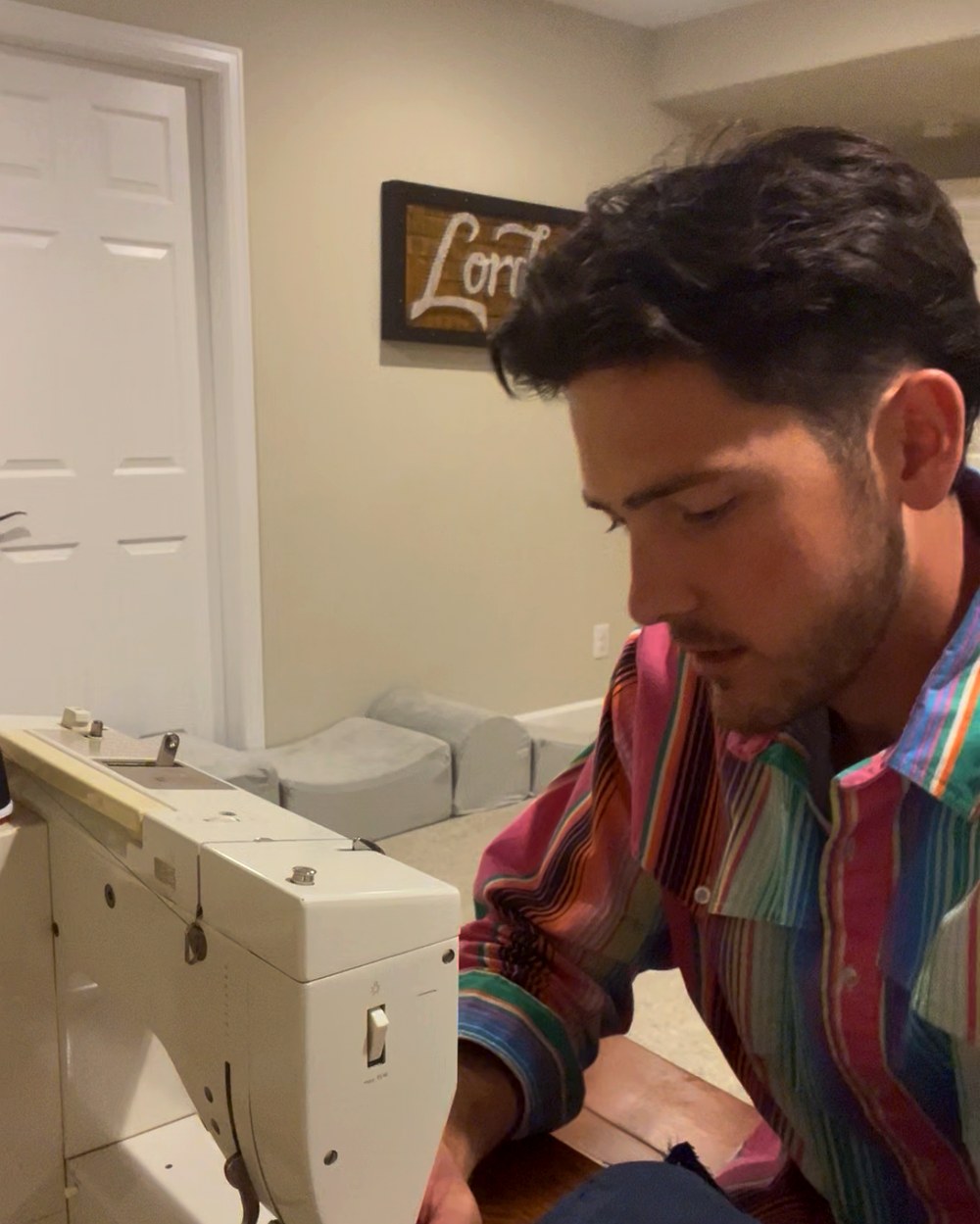 Founder sewing the first pair of Sammies on a borrowed sewing machine